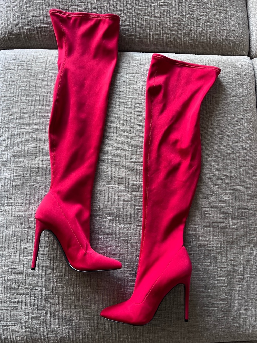 Sexy red knee-high heeled boots